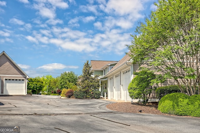 view of property exterior featuring a garage