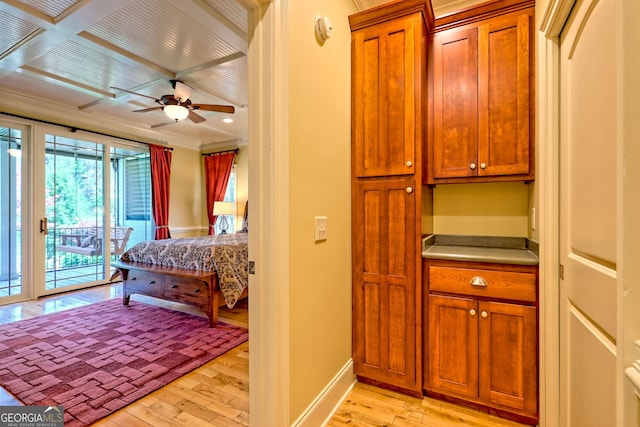 bedroom featuring baseboards, access to exterior, light wood-style flooring, and ornamental molding