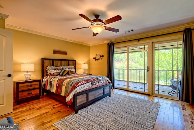 bedroom with access to outside, hardwood / wood-style floors, a ceiling fan, visible vents, and ornamental molding