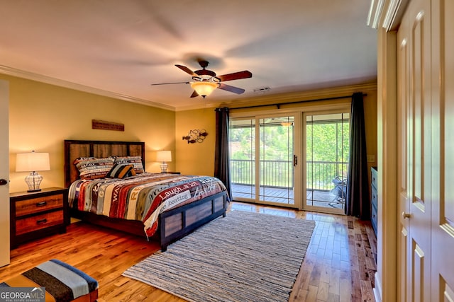 bedroom with visible vents, ornamental molding, hardwood / wood-style flooring, and access to exterior
