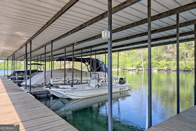 view of dock featuring boat lift and a water view