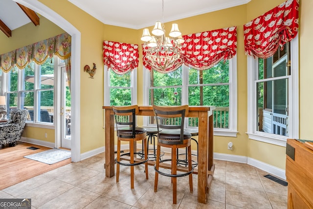 147 S Pine Cove Dr, Lagrange, GA 30240 - tiled dining area with a chandelier, ornamental molding, and arched walkways