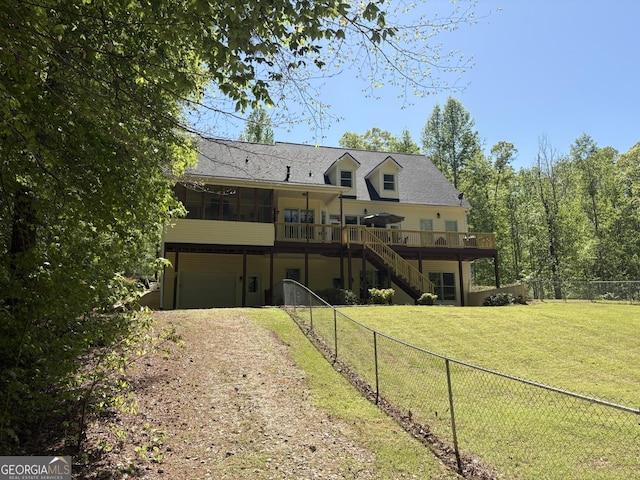 147 S Pine Cove Dr, Lagrange, GA 30240 - back of house featuring a wooden deck, stairs, dirt driveway, an attached garage, and a fenced backyard