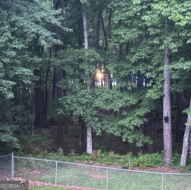 147 S Pine Cove Dr, Lagrange, GA 30240 - view of tennis court with a view of trees