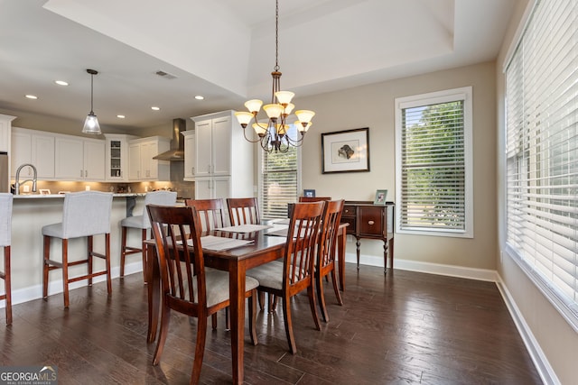 dining area with baseboards, recessed lighting, a notable chandelier, and dark wood-style floors
