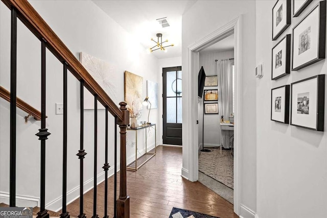 2669 Caruso Way, Atlanta, GA 30339 - foyer entrance featuring an inviting chandelier, stairs, baseboards, and hardwood / wood-style flooring