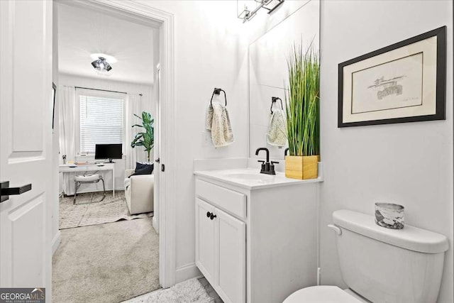 2669 Caruso Way, Atlanta, GA 30339 - bathroom featuring vanity, baseboards, and toilet