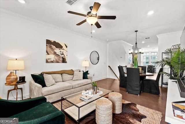 2669 Caruso Way, Atlanta, GA 30339 - living area with visible vents, dark wood finished floors, ceiling fan with notable chandelier, ornamental molding, and recessed lighting