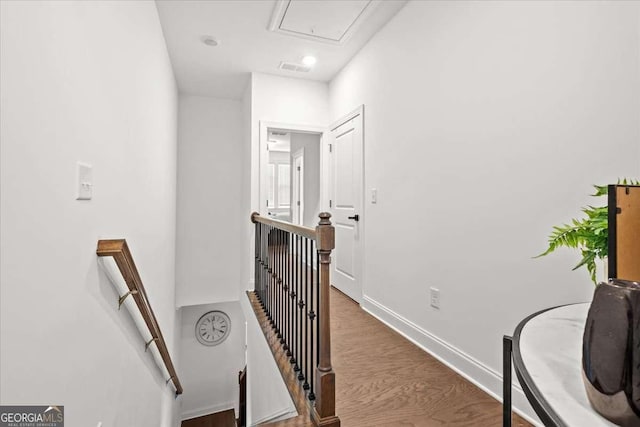 2669 Caruso Way, Atlanta, GA 30339 - hallway with attic access, baseboards, an upstairs landing, wood finished floors, and visible vents