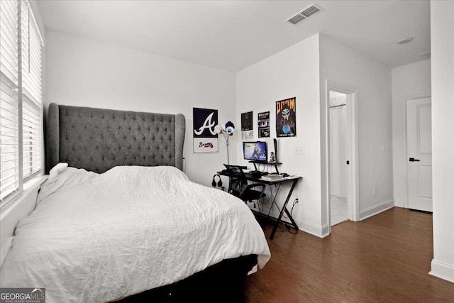 2669 Caruso Way, Atlanta, GA 30339 - bedroom featuring visible vents, baseboards, and wood finished floors