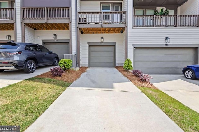 2669 Caruso Way, Atlanta, GA 30339 - exterior space featuring an attached garage, central AC, and driveway