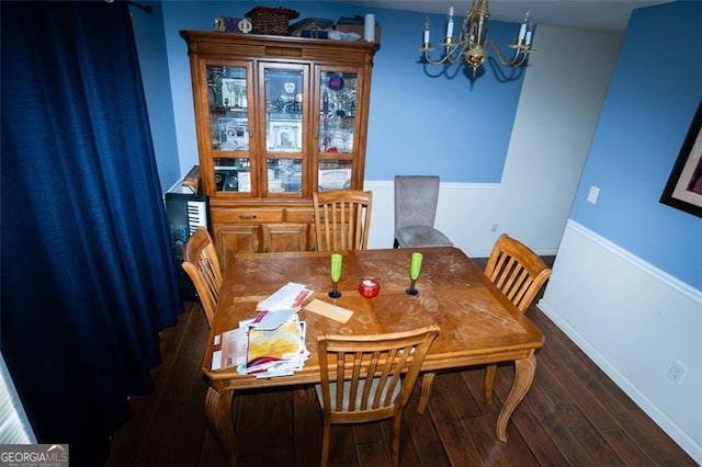 4041 Smithfield Trl, Ellenwood, GA 30294 - dining room featuring baseboards, a chandelier, and wood finished floors