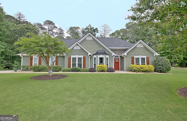 craftsman inspired home featuring a front yard and stucco siding