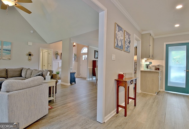 living room with crown molding, baseboards, light wood-type flooring, recessed lighting, and a ceiling fan