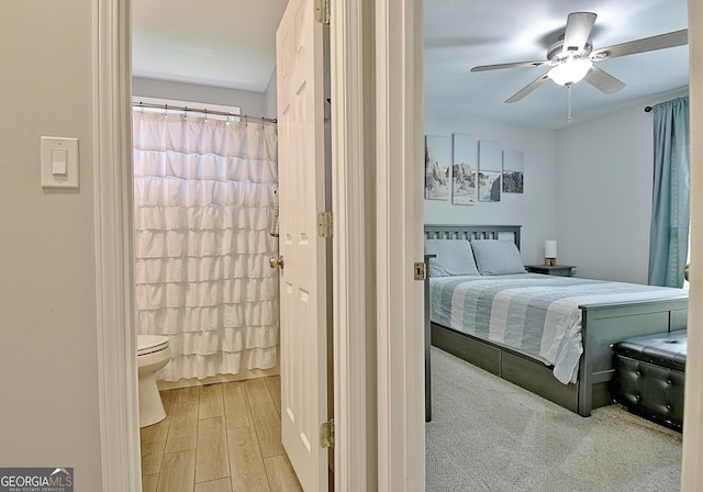 bedroom with a ceiling fan and wood finished floors