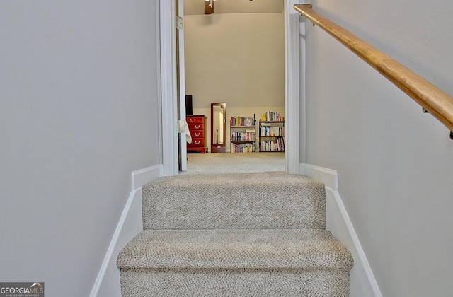 stairs featuring carpet floors