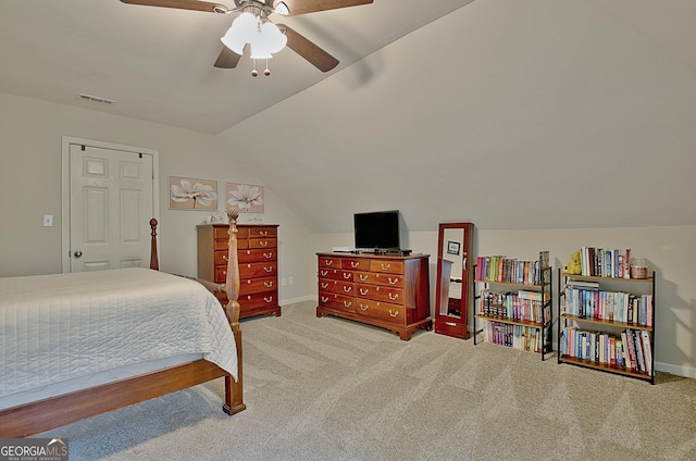 bedroom featuring baseboards, carpet, lofted ceiling, and visible vents