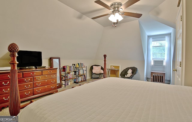 bedroom with radiator heating unit, carpet floors, ceiling fan, and vaulted ceiling