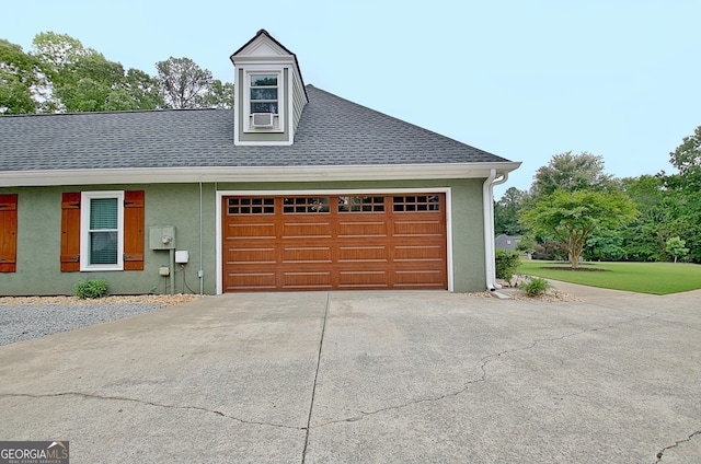 garage with cooling unit and driveway