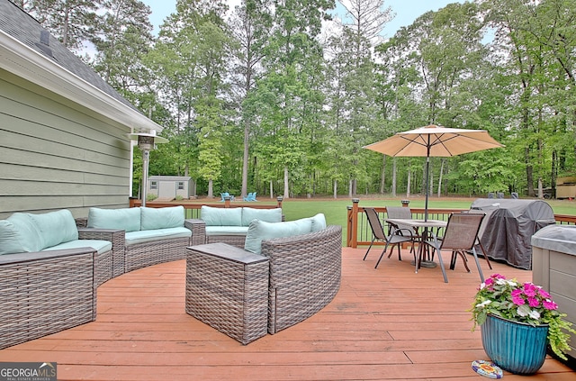 wooden deck with outdoor dining space, an outdoor living space, and grilling area