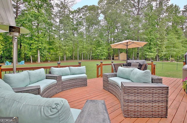 deck featuring a lawn, an outbuilding, an outdoor hangout area, and a storage unit