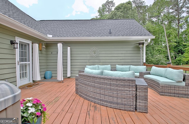 wooden deck with an outdoor living space
