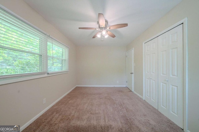 3497 Glensford Dr, Decatur, GA 30032 - unfurnished bedroom featuring a closet, baseboards, a ceiling fan, and carpet flooring