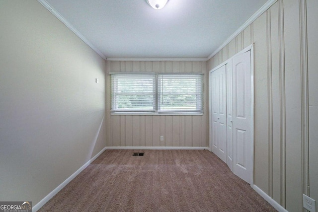 3497 Glensford Dr, Decatur, GA 30032 - unfurnished bedroom featuring baseboards, ornamental molding, carpet floors, and visible vents