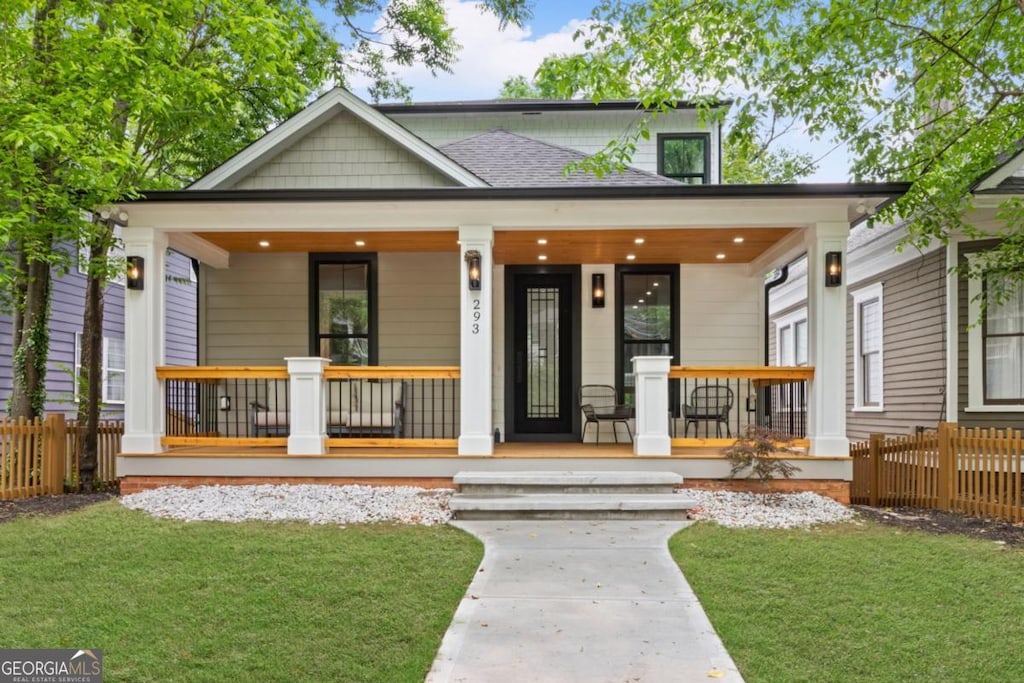 293 Ormond St SE, Atlanta, GA 30315 - view of front of house with a porch, fence, and a front lawn