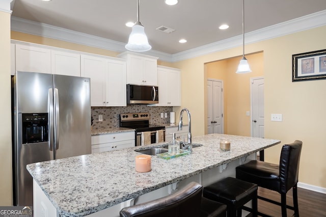 406 Crescent Woode Dr, Dallas, GA 30157 - kitchen featuring a sink, a kitchen breakfast bar, white cabinets, and stainless steel appliances