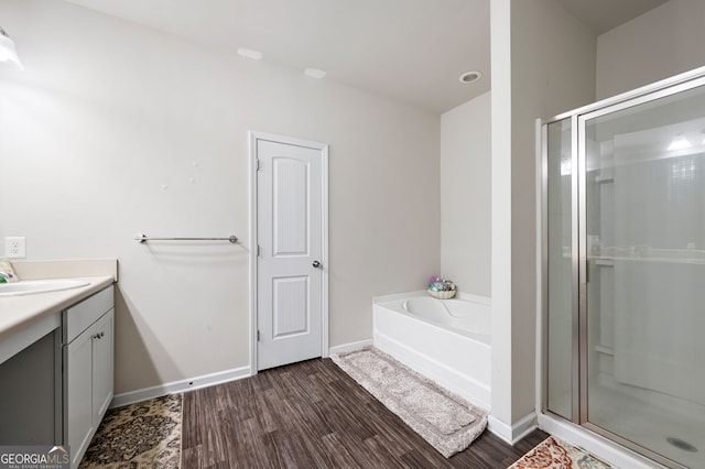 406 Crescent Woode Dr, Dallas, GA 30157 - full bath with vanity, baseboards, a stall shower, and wood finished floors