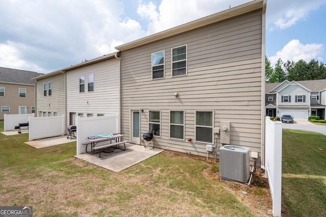 406 Crescent Woode Dr, Dallas, GA 30157 - back of property featuring central AC unit, a patio area, fence, and a yard