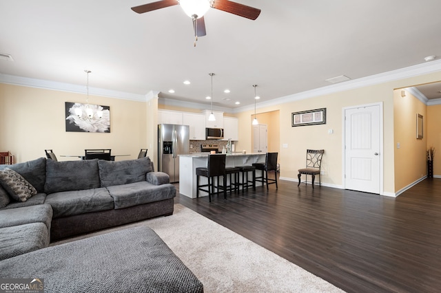 406 Crescent Woode Dr, Dallas, GA 30157 - living area with crown molding, dark wood-style flooring, baseboards, recessed lighting, and ceiling fan with notable chandelier