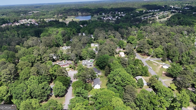 bird's eye view featuring a water view and a forest view
