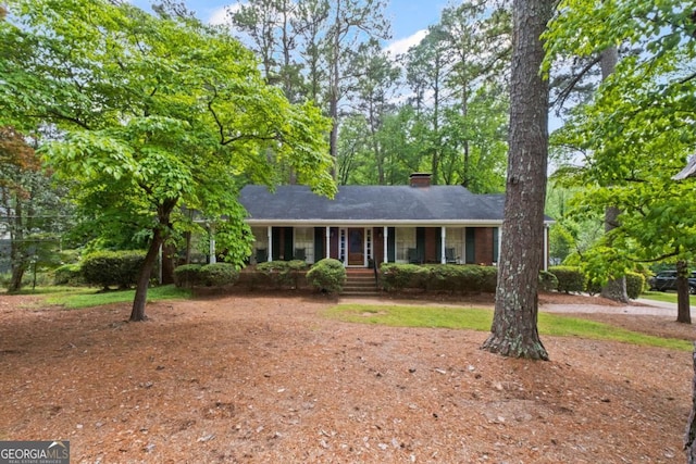 681 Hampton Pl SW, Marietta, GA 30064 - ranch-style home featuring a chimney, a porch, and driveway