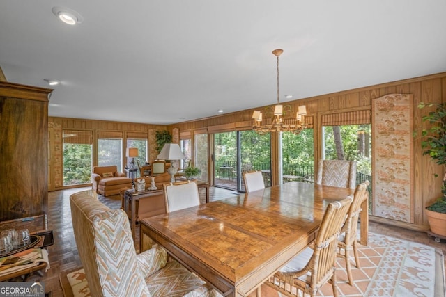 681 Hampton Pl SW, Marietta, GA 30064 - dining space with a chandelier and wooden walls