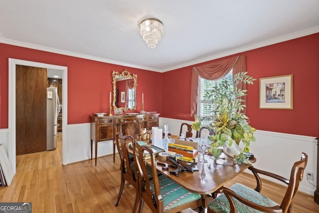 681 Hampton Pl SW, Marietta, GA 30064 - dining room with ornamental molding, wainscoting, and wood finished floors