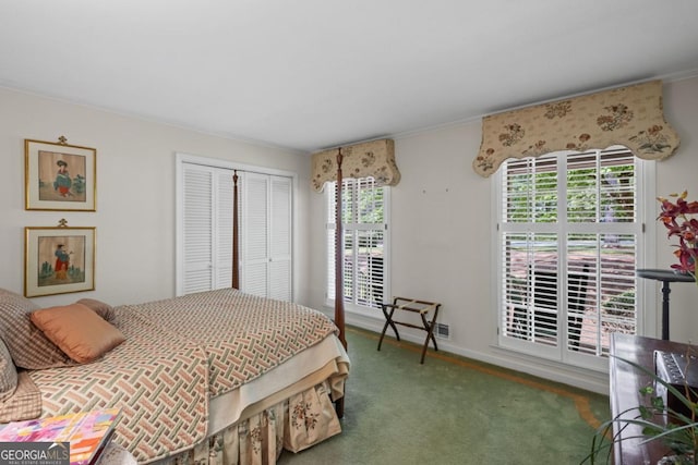 681 Hampton Pl SW, Marietta, GA 30064 - carpeted bedroom featuring baseboards, multiple windows, ornamental molding, and a closet
