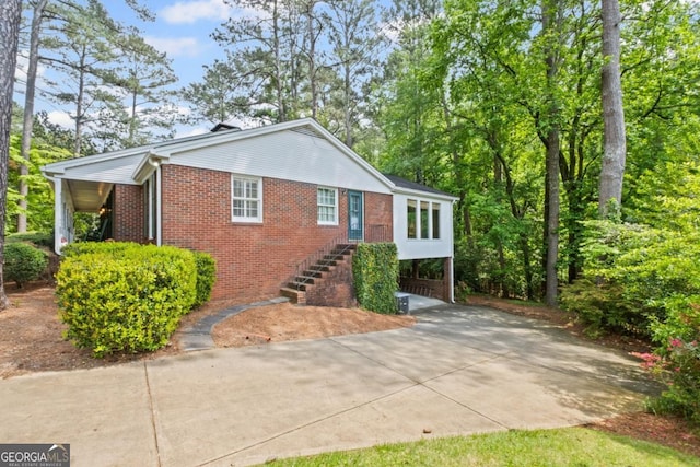 681 Hampton Pl SW, Marietta, GA 30064 - single story home with brick siding, stairs, driveway, and a carport