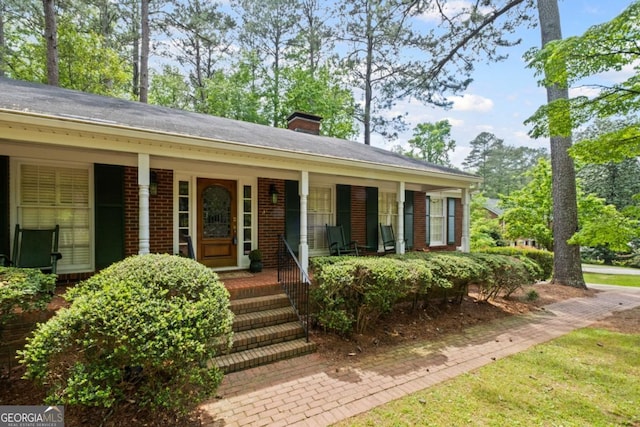681 Hampton Pl SW, Marietta, GA 30064 - single story home featuring covered porch, a chimney, and brick siding