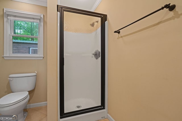 5755 Hendrix Rd, Cumming, GA 30040 - full bathroom featuring a stall shower, baseboards, tile patterned floors, toilet, and ornamental molding