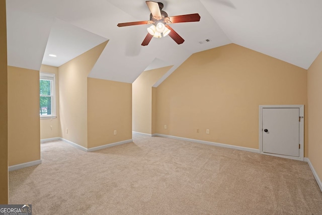 5755 Hendrix Rd, Cumming, GA 30040 - bonus room featuring light carpet, vaulted ceiling, ceiling fan, and baseboards