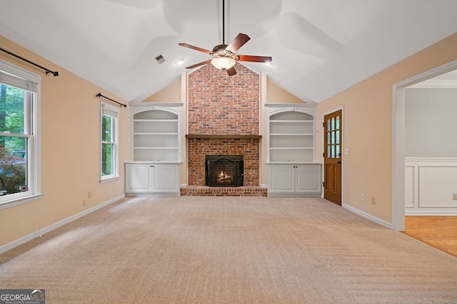 5755 Hendrix Rd, Cumming, GA 30040 - unfurnished living room with a ceiling fan, built in features, light colored carpet, a brick fireplace, and vaulted ceiling