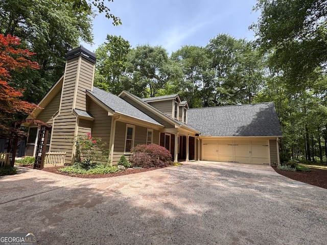 5755 Hendrix Rd, Cumming, GA 30040 - view of front facade featuring asphalt driveway, a garage, a shingled roof, and a chimney