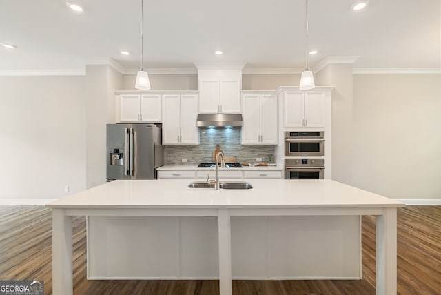 kitchen with a sink, a center island with sink, ornamental molding, and stainless steel appliances