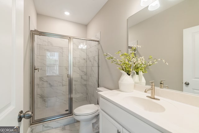 bathroom with vanity, a stall shower, toilet, and marble finish floor
