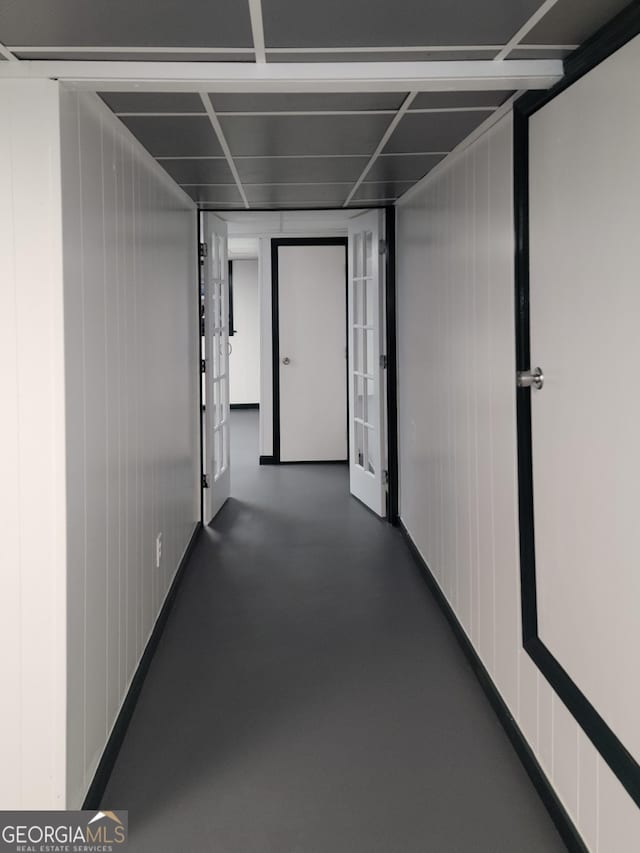 hall with concrete flooring