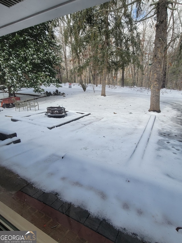 view of yard covered in snow