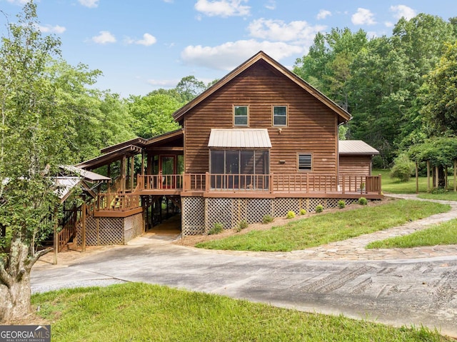 966 Wahoo Creek Rd, Murrayville, GA 30564 - back of house with a lawn, a wooden deck, driveway, and metal roof