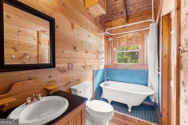 966 Wahoo Creek Rd, Murrayville, GA 30564 - bathroom with a freestanding bath, wood walls, vanity, wooden ceiling, and toilet
